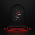 A dark promotional display showing a card deck box labeled 'Desire Designer' with red and white text, placed on a black tiered pedestal with glowing red ring lights against a black background.